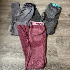 3 pairs of Gymshark Leggings - Gray, Dark Gray, and red